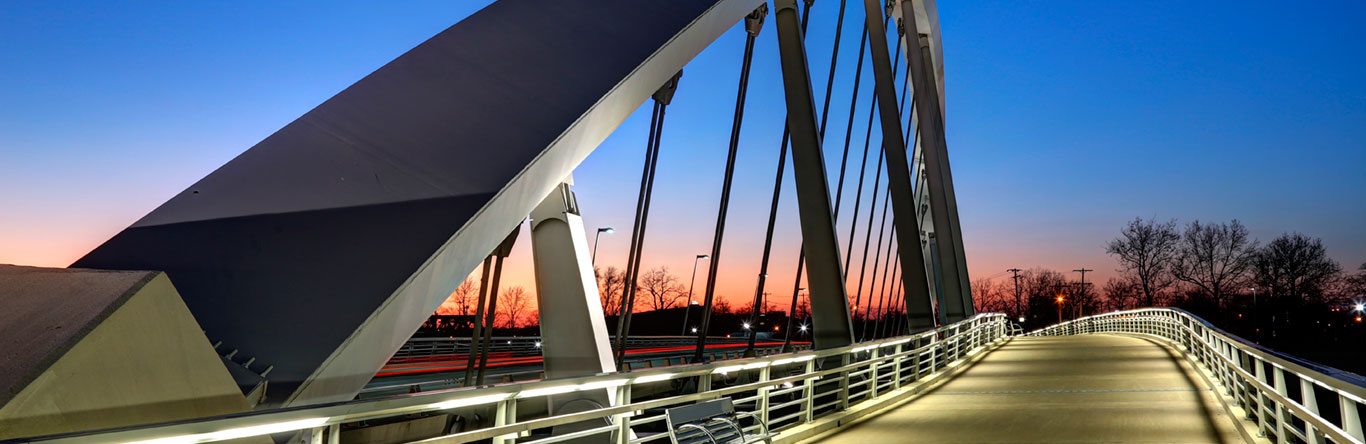 looking across bridge into sunset